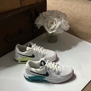 Nike White Sneakers with Black Swoosh and Colorful Soles